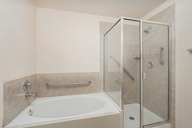 732 Harrison Ln, Lavon, TX 75166 - bathroom featuring a shower stall and a garden tub