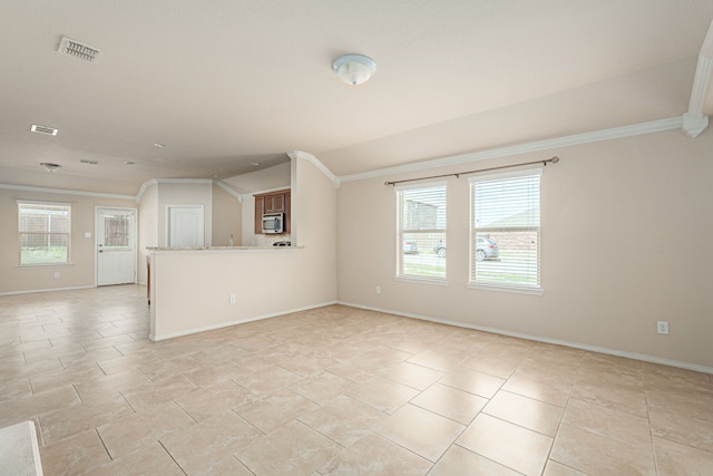 732 Harrison Ln, Lavon, TX 75166 - unfurnished living room with ornamental molding, baseboards, and visible vents
