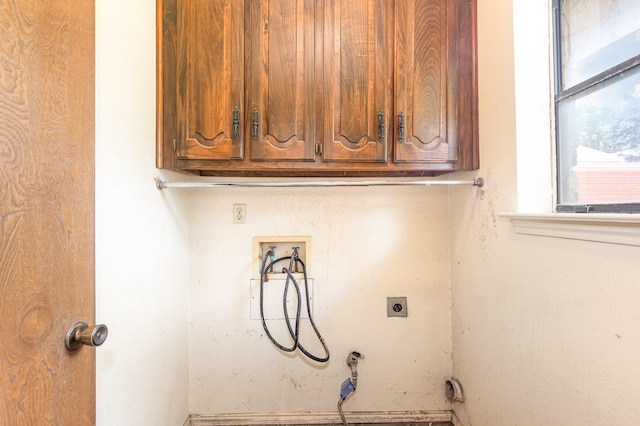 107 Russell Dr, Highland Village, TX 75077 - laundry area with cabinet space, hookup for a washing machine, and hookup for an electric dryer