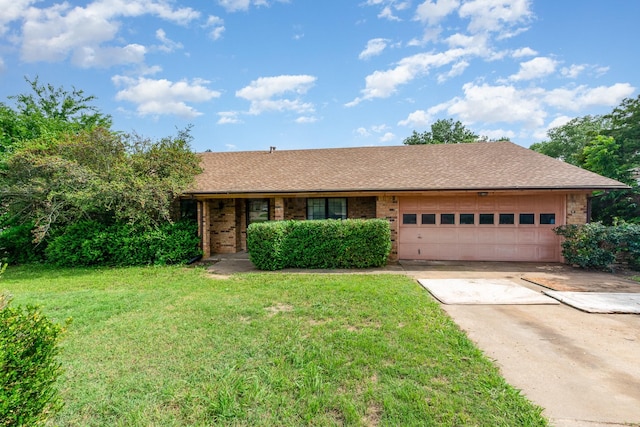 107 Russell Dr, Highland Village, TX 75077 - ranch-style house with a garage, driveway, a front yard, and brick siding