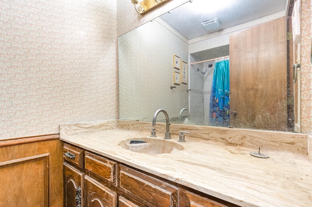 107 Russell Dr, Highland Village, TX 75077 - full bath featuring wallpapered walls, a shower with curtain, vanity, and wainscoting