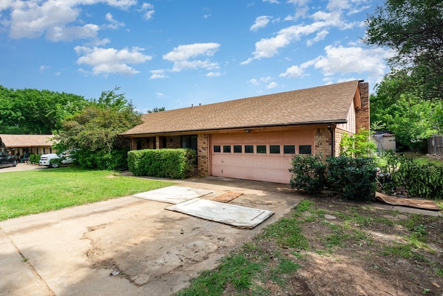 107 Russell Dr, Highland Village, TX 75077 - view of front of home with an attached garage, driveway, a front lawn, and brick siding