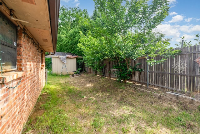 107 Russell Dr, Highland Village, TX 75077 - view of yard featuring a storage unit and an outbuilding