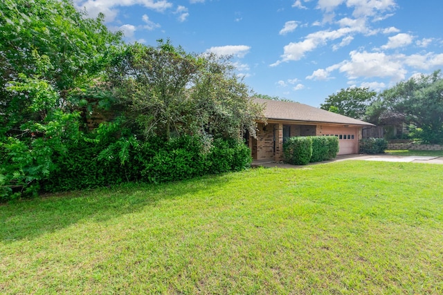 107 Russell Dr, Highland Village, TX 75077 - view of green lawn featuring a garage and driveway