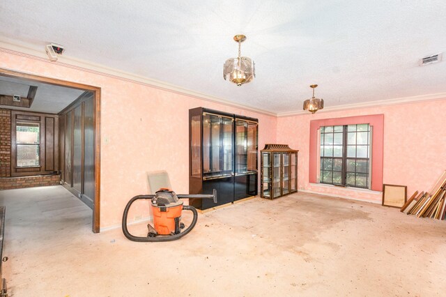 107 Russell Dr, Highland Village, TX 75077 - unfurnished room featuring concrete flooring, plenty of natural light, and crown molding