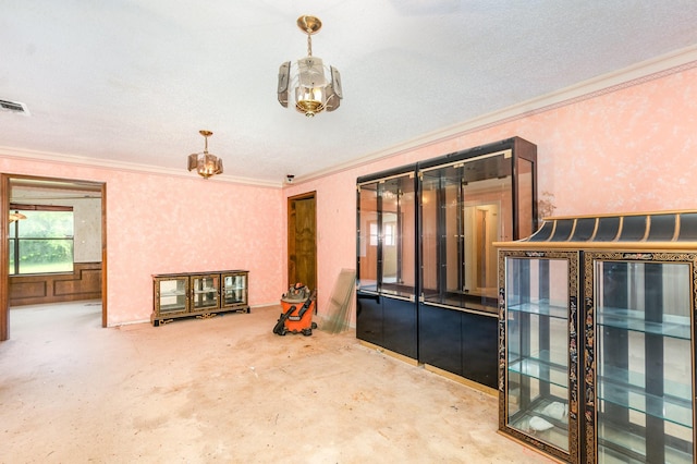 107 Russell Dr, Highland Village, TX 75077 - empty room with ornamental molding, a chandelier, and concrete flooring