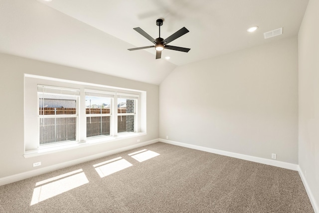 unfurnished room featuring lofted ceiling, carpet, ceiling fan, baseboards, and recessed lighting