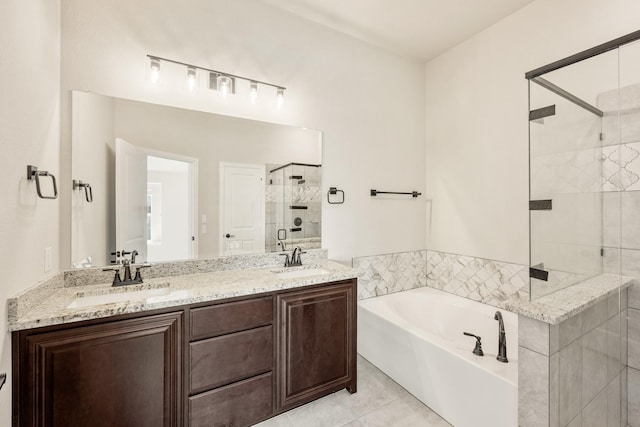 bathroom with a shower stall, a bath, double vanity, and tile patterned floors