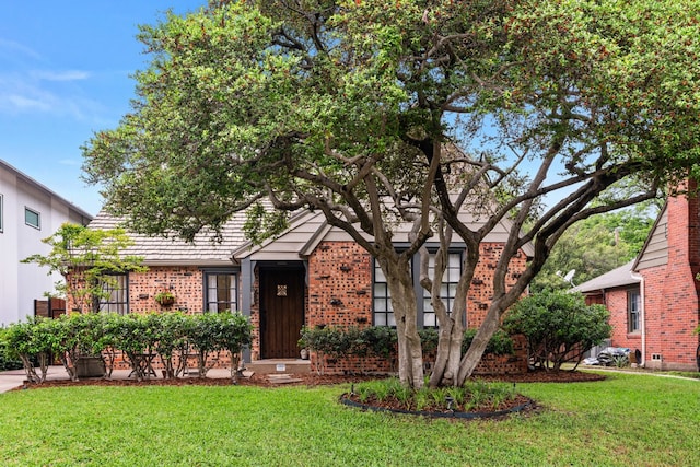 5107 Milam St, Dallas, TX 75206 - view of front facade with brick siding and a front lawn