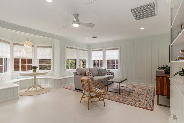 5107 Milam St, Dallas, TX 75206 - living room with ornamental molding, ceiling fan, visible vents, a decorative wall, and wood finished floors