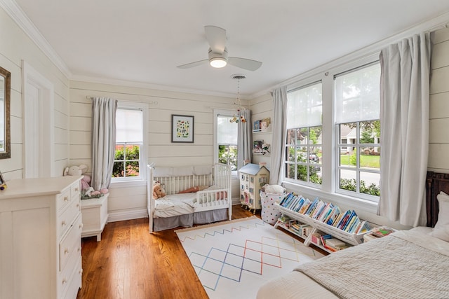 5107 Milam St, Dallas, TX 75206 - bedroom featuring ceiling fan, wood finished floors, and ornamental molding