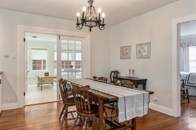 5107 Milam St, Dallas, TX 75206 - dining space featuring baseboards, an inviting chandelier, and wood finished floors