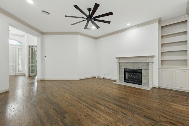 411 Deer Brooke Dr, Allen, TX 75002 - unfurnished living room with ornamental molding, ceiling fan, a tiled fireplace, wood finished floors, and recessed lighting