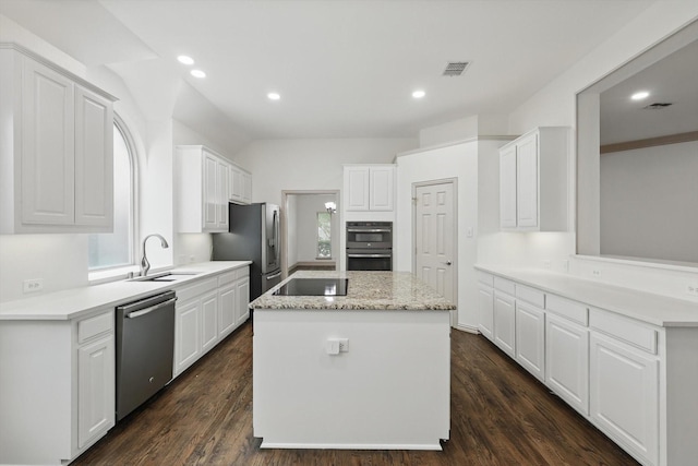 411 Deer Brooke Dr, Allen, TX 75002 - kitchen featuring stainless steel appliances, a sink, a kitchen island, white cabinetry, and recessed lighting