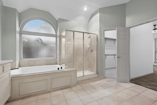 411 Deer Brooke Dr, Allen, TX 75002 - full bath with a shower stall, a bath, tile patterned flooring, lofted ceiling, and a walk in closet