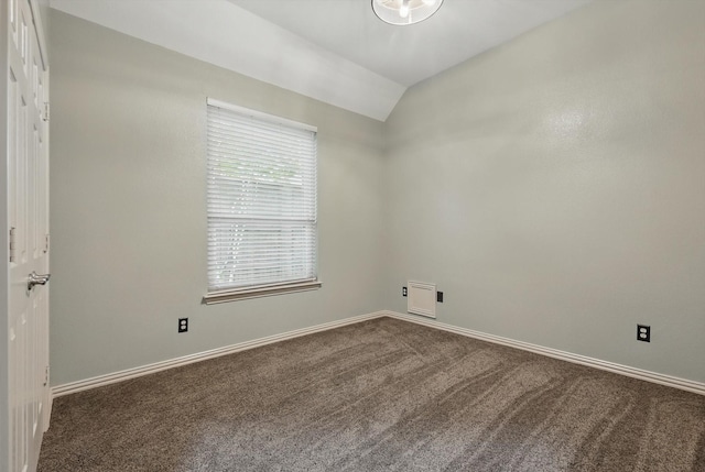 411 Deer Brooke Dr, Allen, TX 75002 - empty room featuring dark carpet, vaulted ceiling, and baseboards