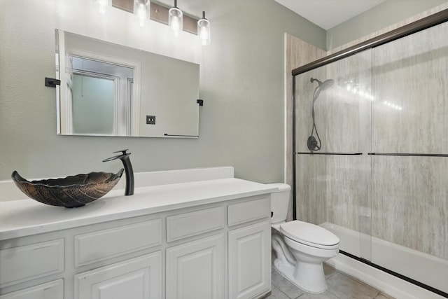 411 Deer Brooke Dr, Allen, TX 75002 - bathroom with a shower with door, vanity, toilet, and tile patterned floors