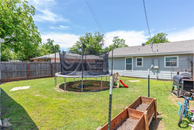 1773 Westview Dr, Abilene, TX 79603 - view of yard featuring a trampoline and a vegetable garden