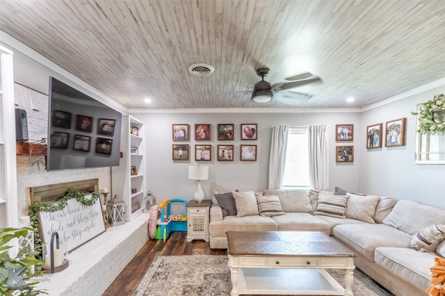 1773 Westview Dr, Abilene, TX 79603 - living area with crown molding, dark wood-type flooring, ceiling fan, a fireplace with raised hearth, and recessed lighting