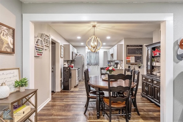 1773 Westview Dr, Abilene, TX 79603 - dining room featuring a chandelier, dark wood-style flooring, recessed lighting, and baseboards