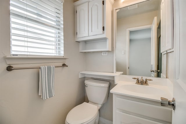 bathroom with toilet and vanity