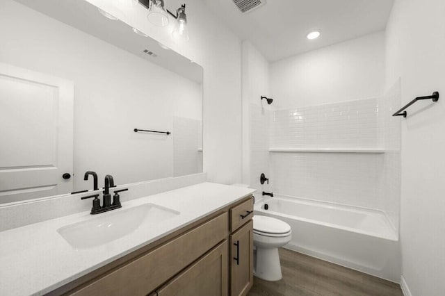 2418 Bulin, Mansfield, TX 76063 - bathroom featuring toilet, wood finished floors, vanity, visible vents, and  shower combination