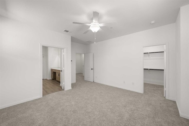 2418 Bulin, Mansfield, TX 76063 - unfurnished bedroom featuring a closet, light colored carpet, visible vents, a walk in closet, and baseboards