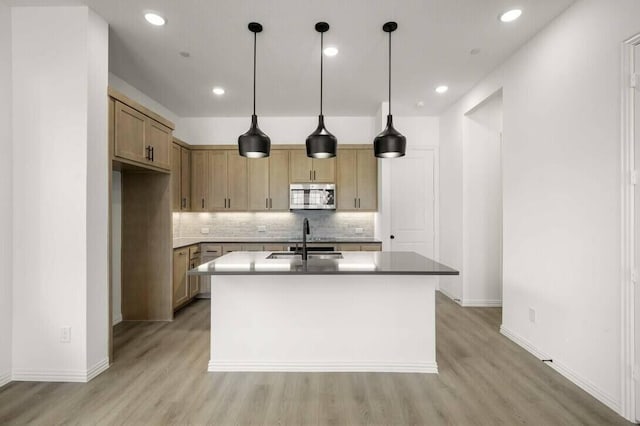 2418 Bulin, Mansfield, TX 76063 - kitchen with a sink, light wood-type flooring, baseboards, stainless steel microwave, and tasteful backsplash
