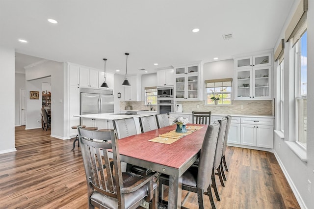 dining area featuring recessed lighting, visible vents, and light wood-style floors