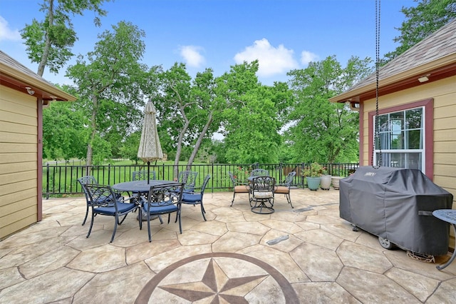 view of patio featuring outdoor dining area and grilling area