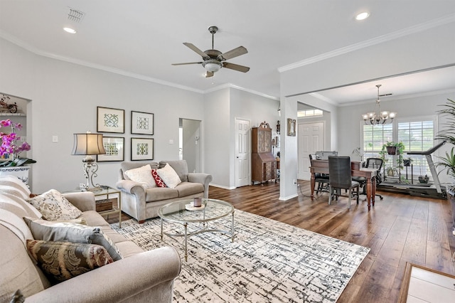 living room with visible vents, baseboards, ceiling fan with notable chandelier, and hardwood / wood-style flooring