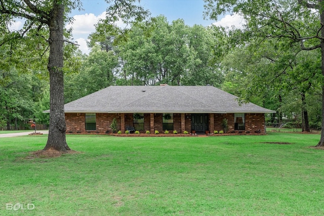 ranch-style home with a front lawn and brick siding