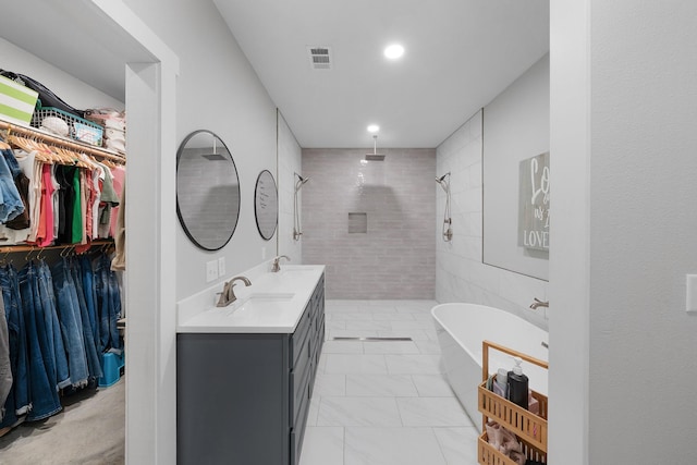 13533 Fm-1567 W, Brashear, TX 75433 - full bath with a tile shower, double vanity, a walk in closet, a freestanding tub, and marble finish flooring