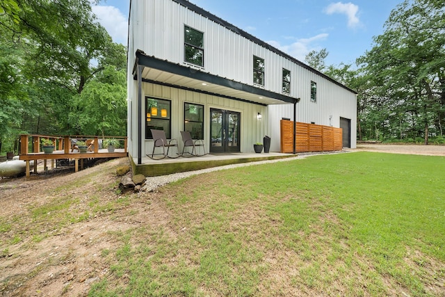 13533 Fm-1567 W, Brashear, TX 75433 - back of property featuring french doors, board and batten siding, a garage, a yard, and driveway