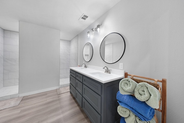 13533 Fm-1567 W, Brashear, TX 75433 - bathroom featuring walk in shower, double vanity, wood finished floors, and baseboards