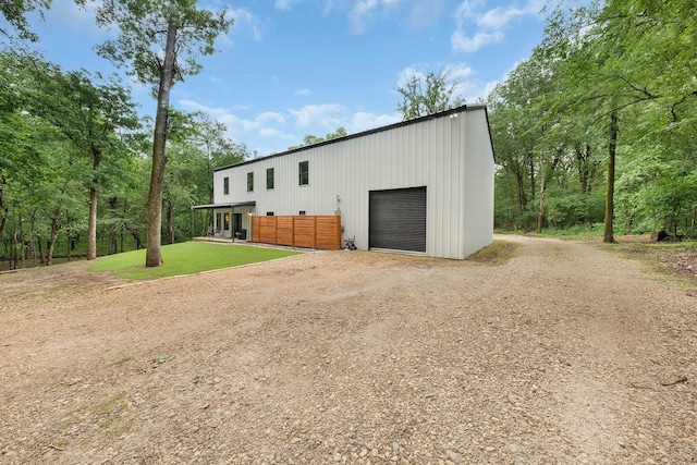 13533 Fm-1567 W, Brashear, TX 75433 - view of front facade with dirt driveway, an outbuilding, a garage, and a pole building