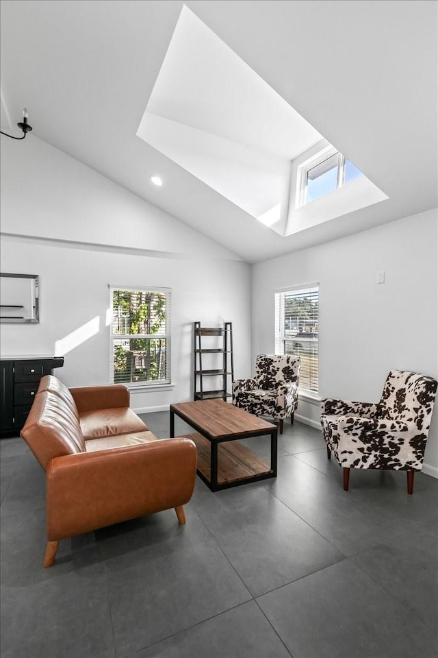 living area featuring lofted ceiling with skylight, baseboards, and recessed lighting