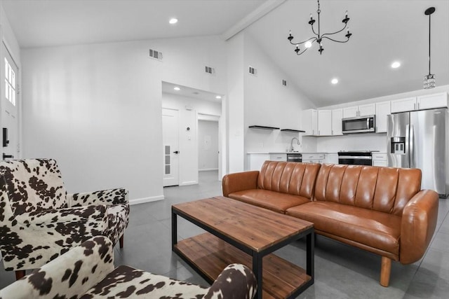 tiled living area featuring recessed lighting, high vaulted ceiling, visible vents, and a notable chandelier