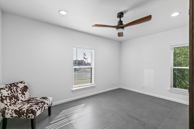 sitting room featuring baseboards, recessed lighting, and a ceiling fan