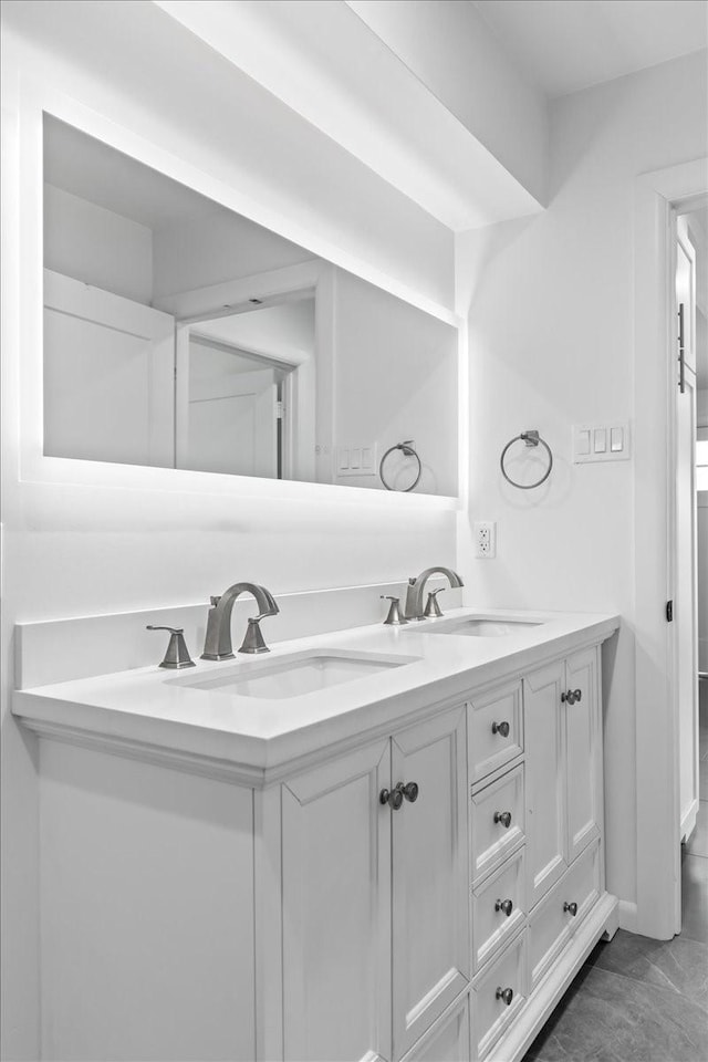 bathroom with double vanity and a sink