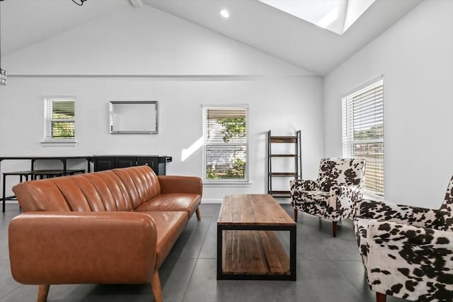 living area with high vaulted ceiling, plenty of natural light, and recessed lighting