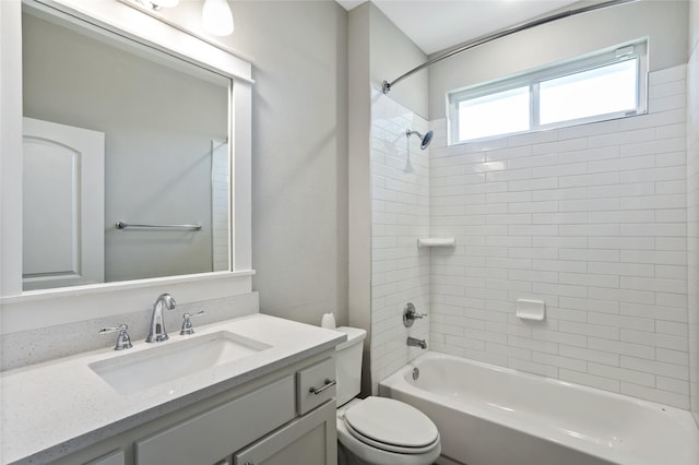 bathroom featuring shower / bath combination, vanity, and toilet