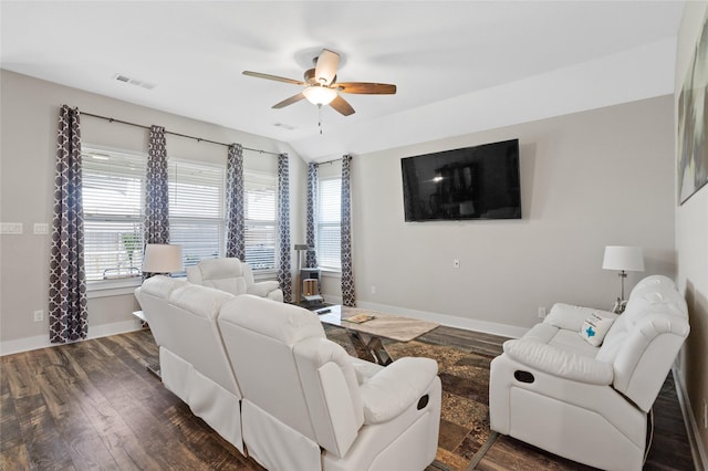 living area with dark wood-style flooring, baseboards, a ceiling fan, and visible vents