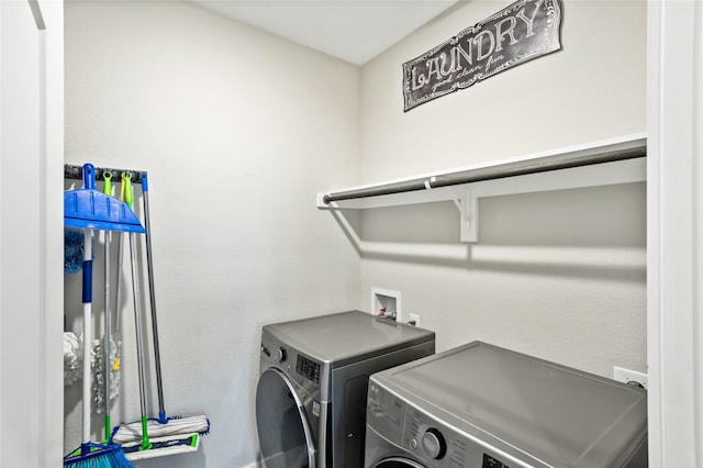 laundry area with washer and clothes dryer and laundry area