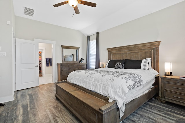 bedroom with a ceiling fan, visible vents, lofted ceiling, and dark wood-style floors