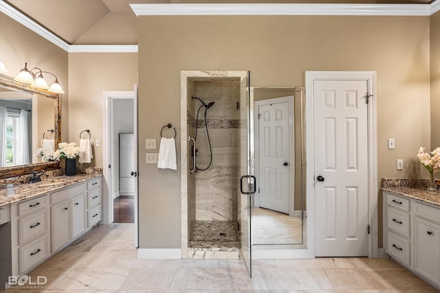 bathroom featuring crown molding, baseboards, a shower stall, vaulted ceiling, and vanity