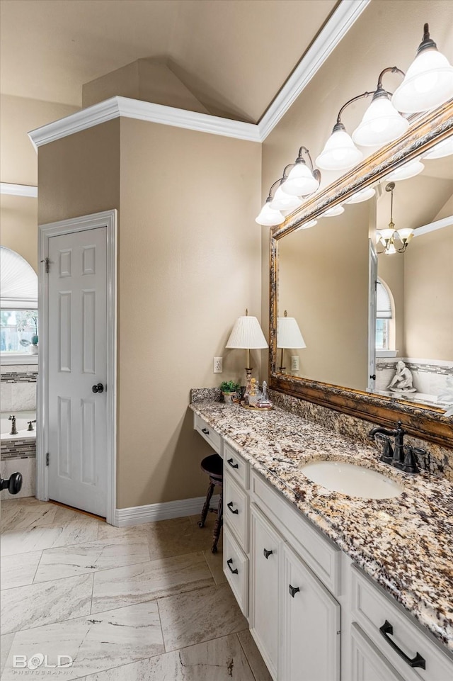 bathroom featuring vanity, plenty of natural light, lofted ceiling, and crown molding