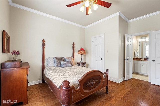 bedroom with connected bathroom, wood finished floors, crown molding, baseboards, and ceiling fan