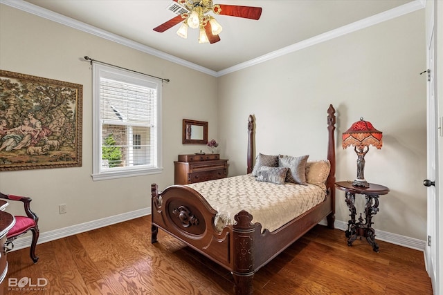 bedroom featuring baseboards, visible vents, crown molding, and wood finished floors