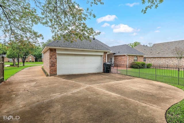 view of front of home with fence, brick siding, driveway, a front yard, and a shingled roof